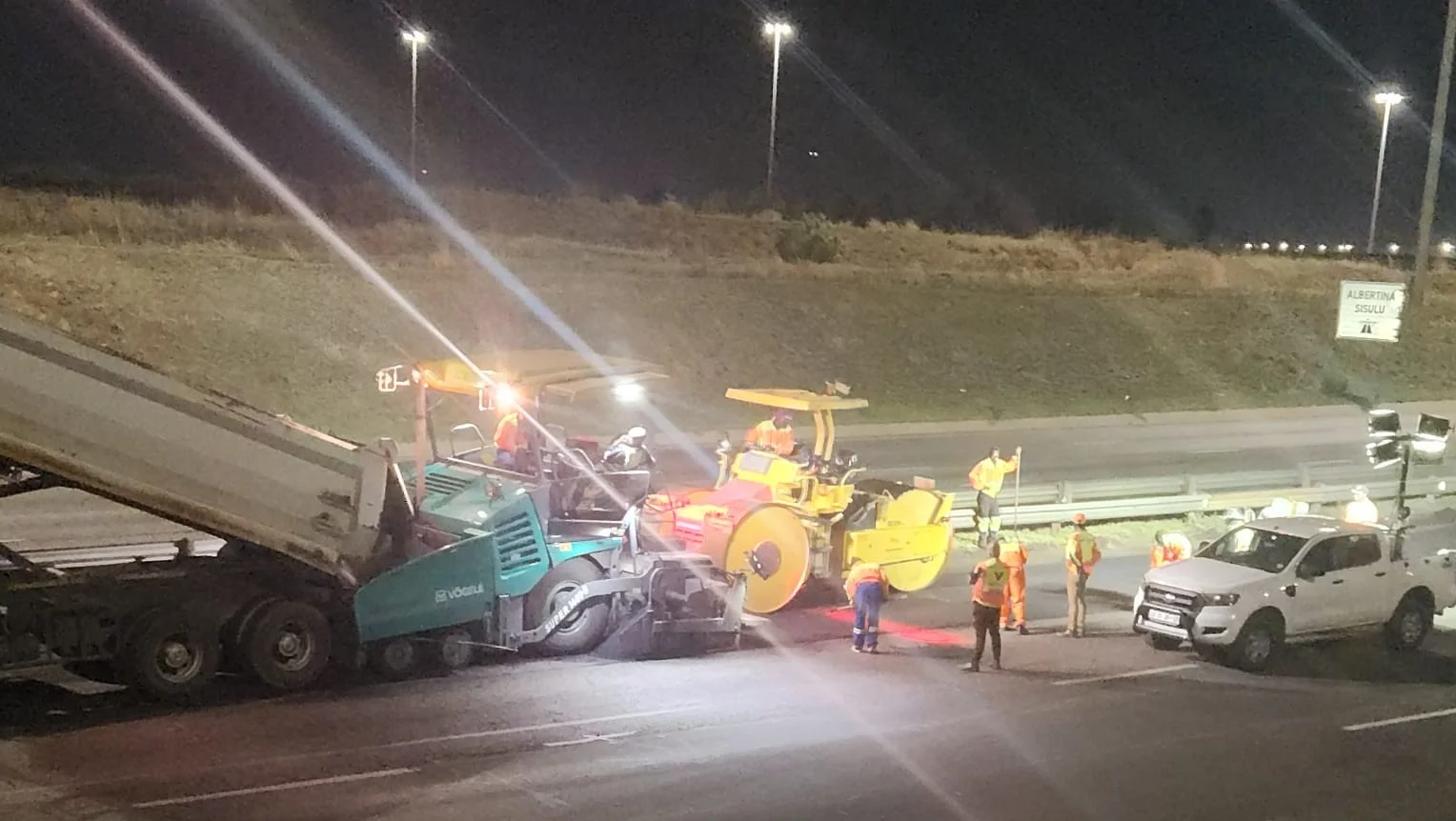 Jobfellas road surfacing machinery working at night